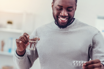 man taking his medicine