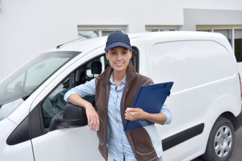 woman infront of a white van