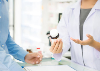 pharmacist holding a medicine